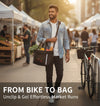 Man carrying the Goodsible basket as a shoulder tote filled with groceries at a street market